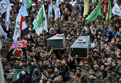 Mourners carry the coffin of Iran-backed Popular Mobilisation fighters killed in the U.S. airstrike in Qaim, during their funeral in Najaf, Iraq. Photograph: Anmar Khalil/AP